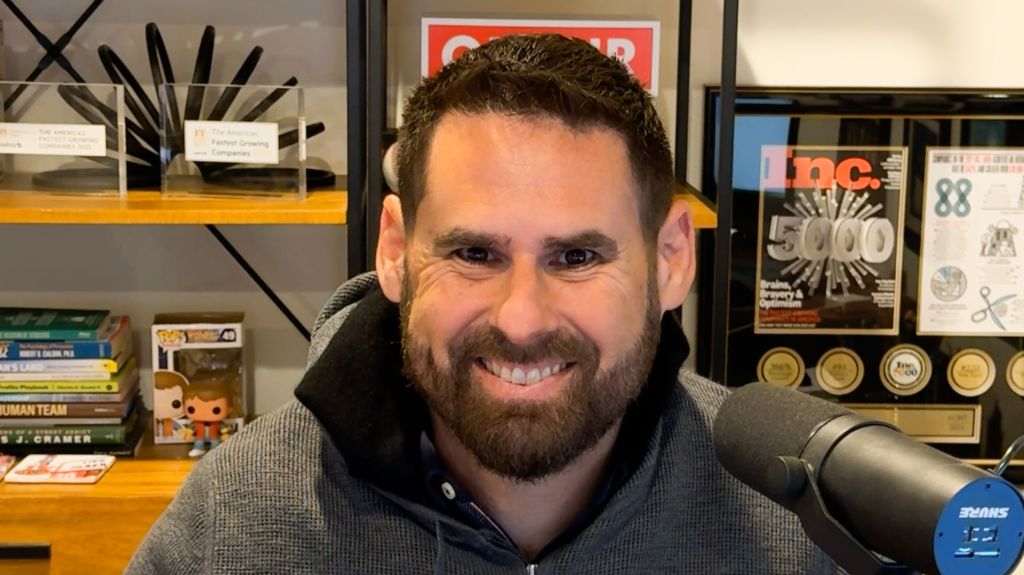 Professional using a Shure SM7B microphone during a Zoom call setup for high-quality remote meetings and podcasting